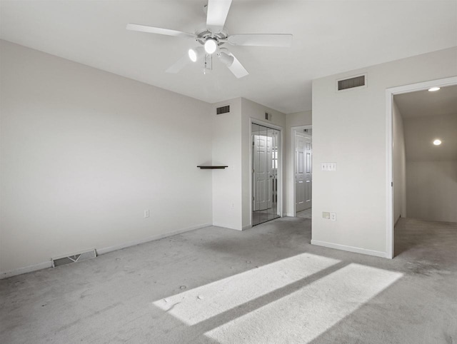 unfurnished bedroom featuring ceiling fan and light colored carpet