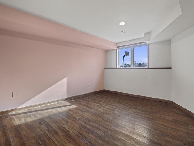 empty room with dark hardwood / wood-style floors