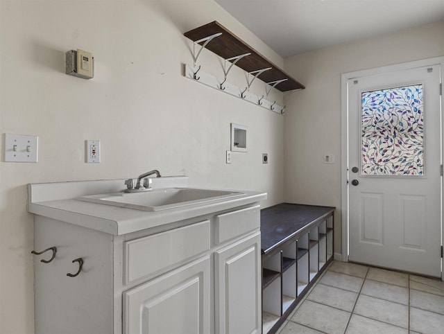 laundry room featuring light tile patterned floors, washer hookup, sink, and electric dryer hookup