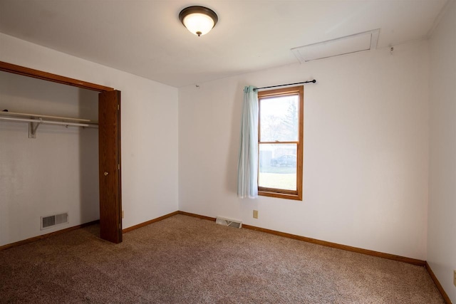 unfurnished bedroom featuring carpet floors and a closet