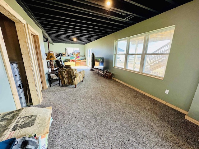 basement featuring a healthy amount of sunlight and carpet