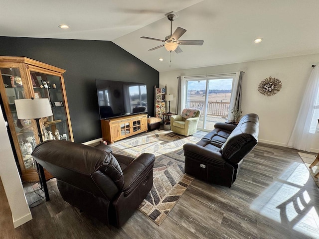 living room featuring hardwood / wood-style flooring, lofted ceiling, and ceiling fan