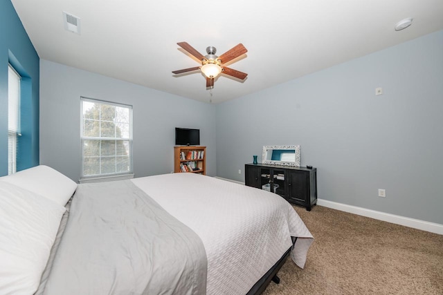 bedroom with ceiling fan and carpet