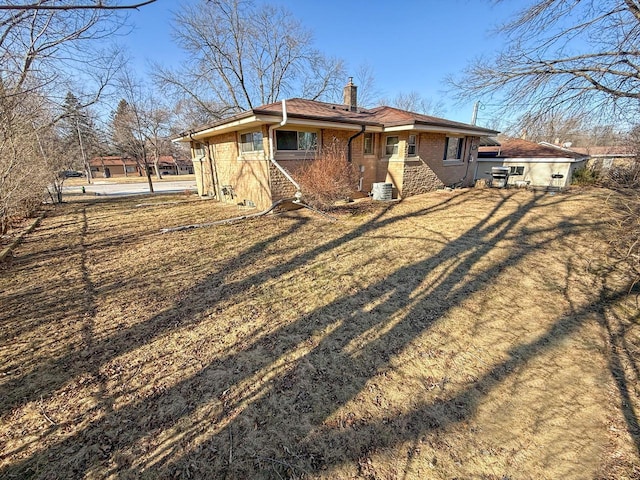 back of house featuring a yard