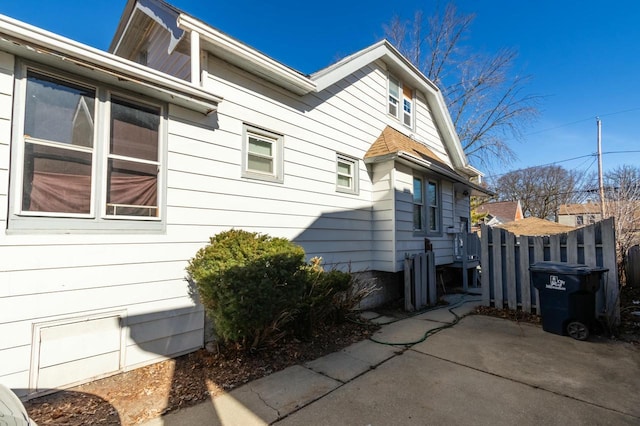 view of side of property featuring a patio area