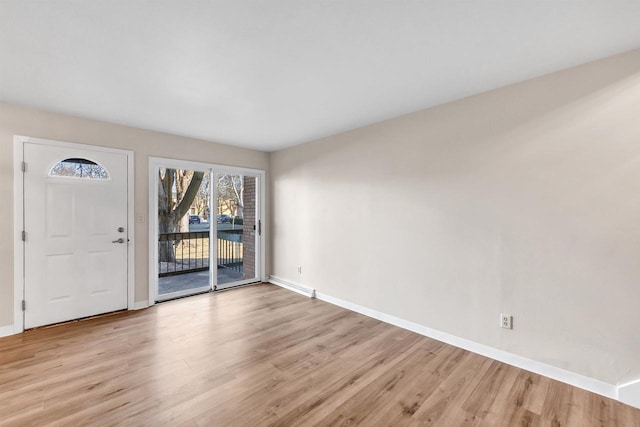 foyer with light hardwood / wood-style floors