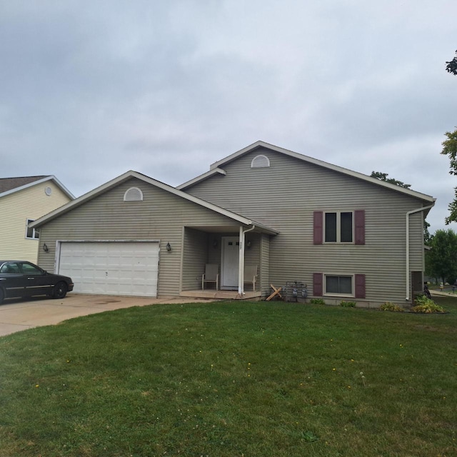 view of front of home featuring a garage and a front yard