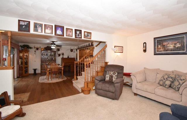 living room featuring hardwood / wood-style flooring and ceiling fan