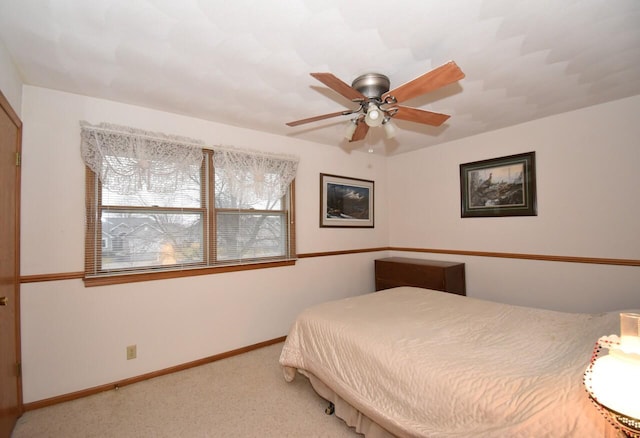 bedroom featuring ceiling fan and carpet flooring