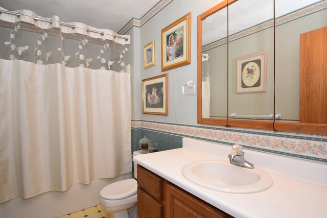 full bathroom featuring vanity, shower / bath combination with curtain, and toilet