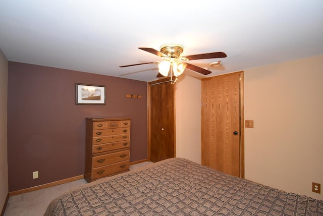 carpeted bedroom featuring ceiling fan