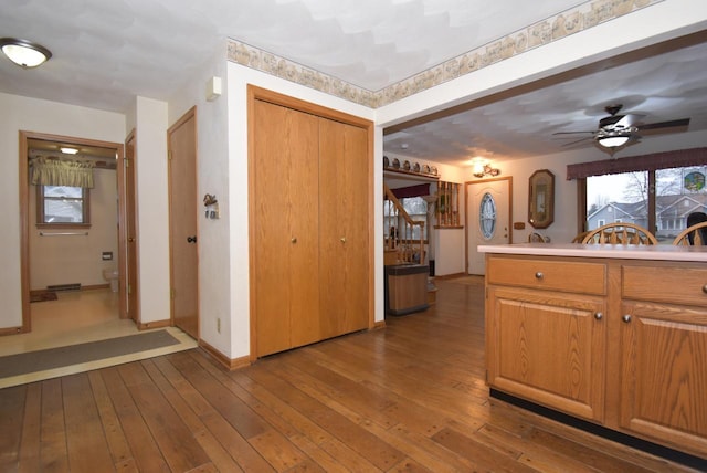 kitchen with hardwood / wood-style floors and ceiling fan