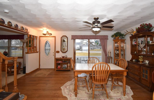 dining room with hardwood / wood-style floors and ceiling fan