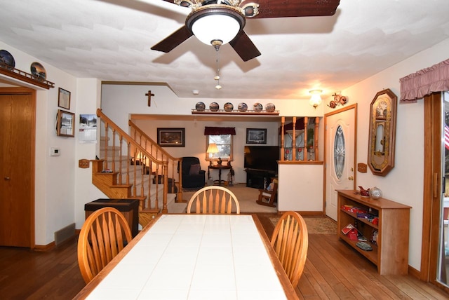 dining area featuring hardwood / wood-style floors and ceiling fan