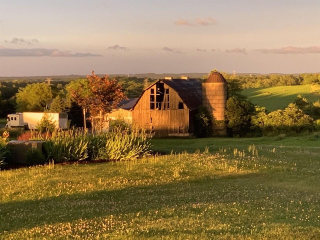 view of side of home with a lawn