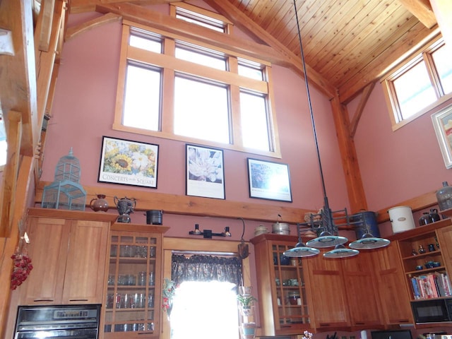 interior details with open shelves, wood ceiling, glass insert cabinets, and brown cabinetry