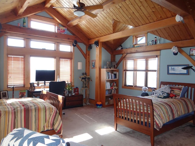 bedroom with light carpet, beamed ceiling, and multiple windows