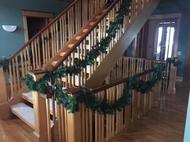 stairway featuring wood finished floors