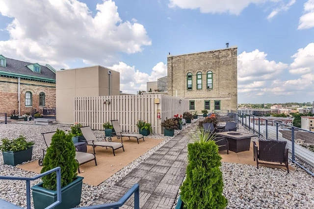 view of patio / terrace with an outdoor fire pit