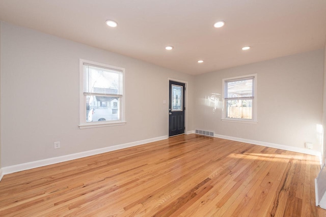 empty room with light wood-type flooring