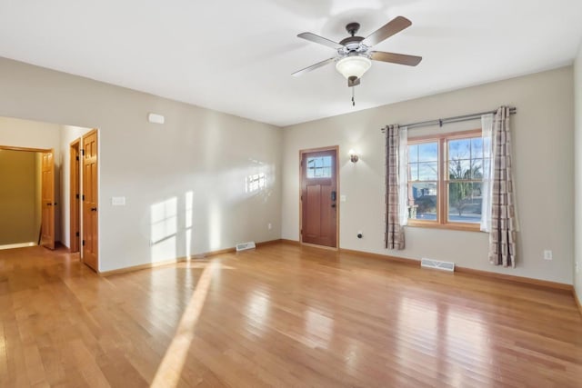 interior space with ceiling fan and light hardwood / wood-style floors