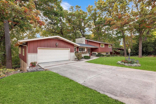 split level home featuring a garage and a front yard