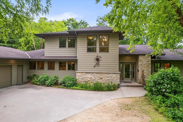 E4725 Riverside Dr, Spring Green, WI 53588 - view of front of house with stone siding and roof with shingles