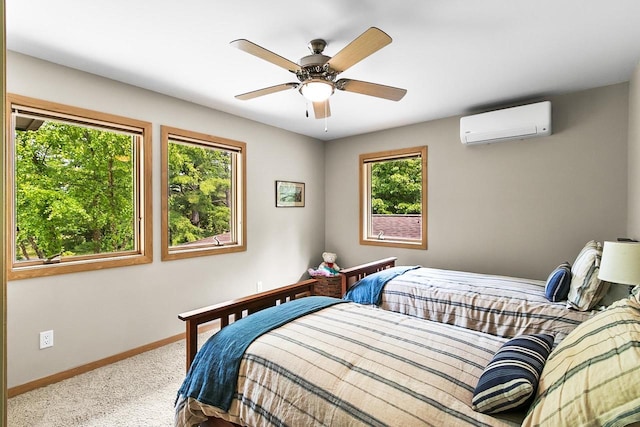 E4725 Riverside Dr, Spring Green, WI 53588 - bedroom with a wall unit AC, multiple windows, carpet floors, and baseboards