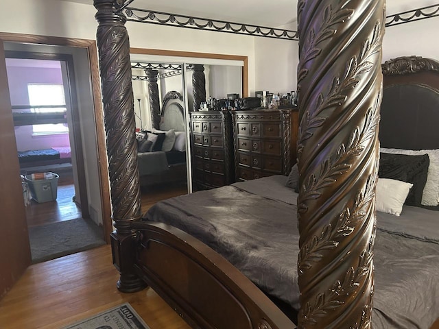 bedroom featuring dark wood-type flooring