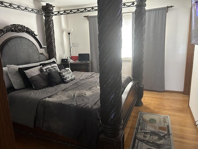 bedroom with hardwood / wood-style floors