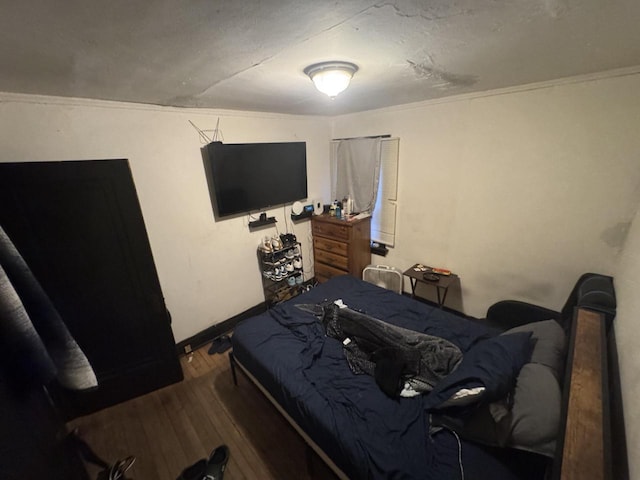 bedroom featuring wood-type flooring