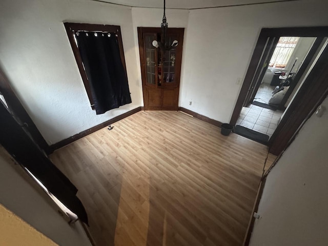 unfurnished room featuring wood-type flooring