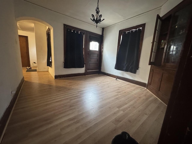 entryway with wood-type flooring