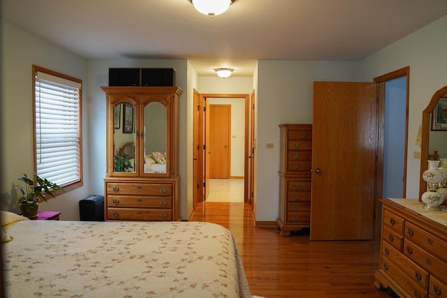 bedroom with wood-type flooring