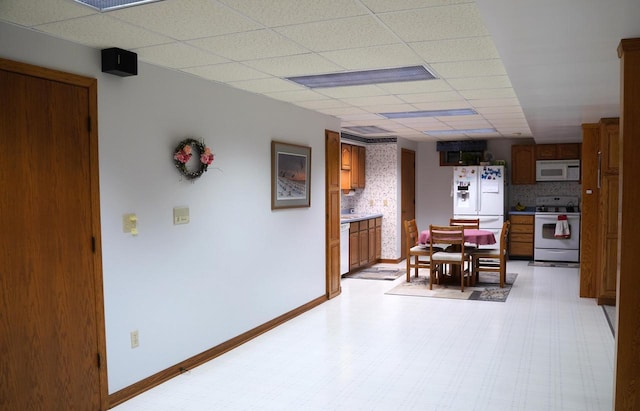 dining area featuring a paneled ceiling