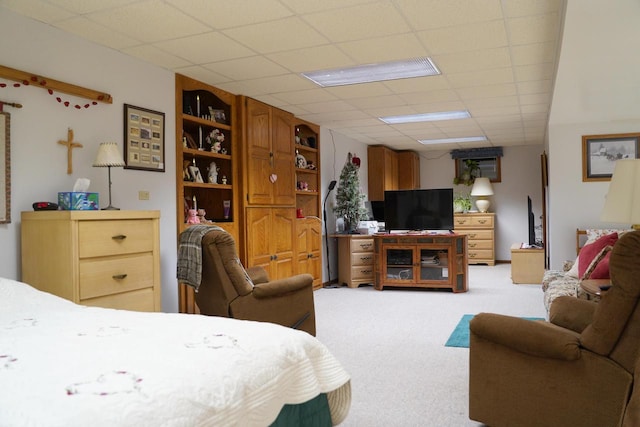 carpeted bedroom with a paneled ceiling