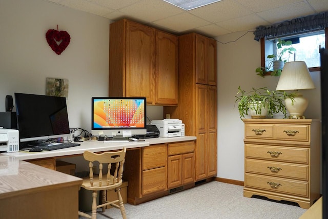 carpeted office featuring a drop ceiling