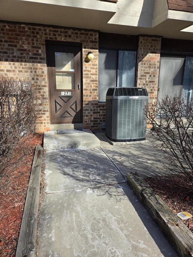 doorway to property featuring central AC unit