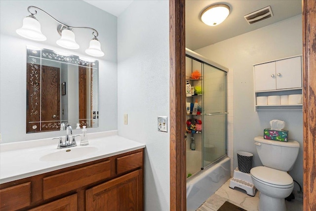 bathroom featuring vanity, toilet, visible vents, and shower / bath combination with glass door