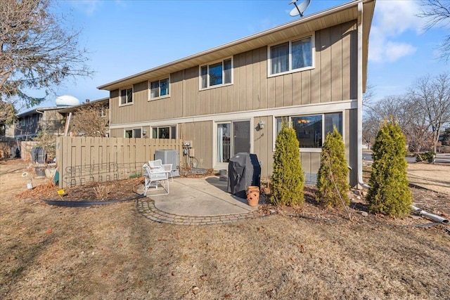 back of house featuring central AC unit, a patio, and fence