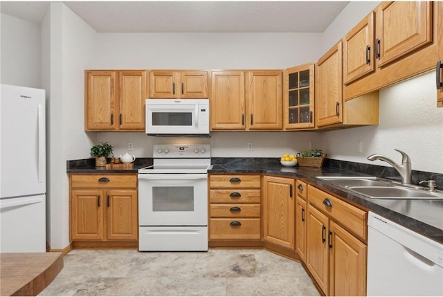 kitchen with white appliances and sink