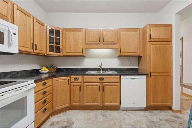 kitchen featuring white appliances and sink