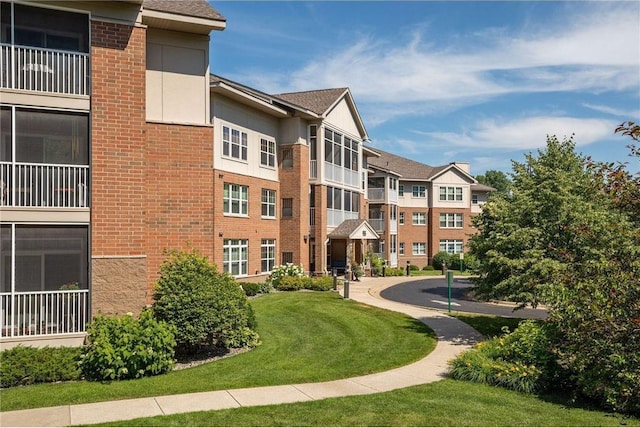 view of community featuring a lawn