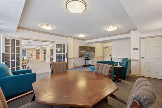 carpeted dining space featuring french doors and a textured ceiling