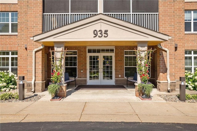 property entrance with french doors and a balcony