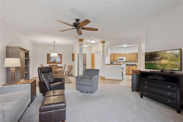 carpeted living room featuring ceiling fan