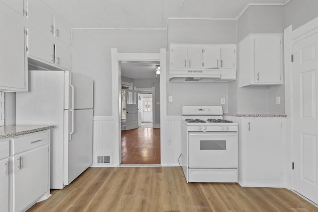 kitchen featuring crown molding, white cabinets, white appliances, and light hardwood / wood-style flooring