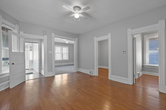 interior space with dark hardwood / wood-style floors and ceiling fan