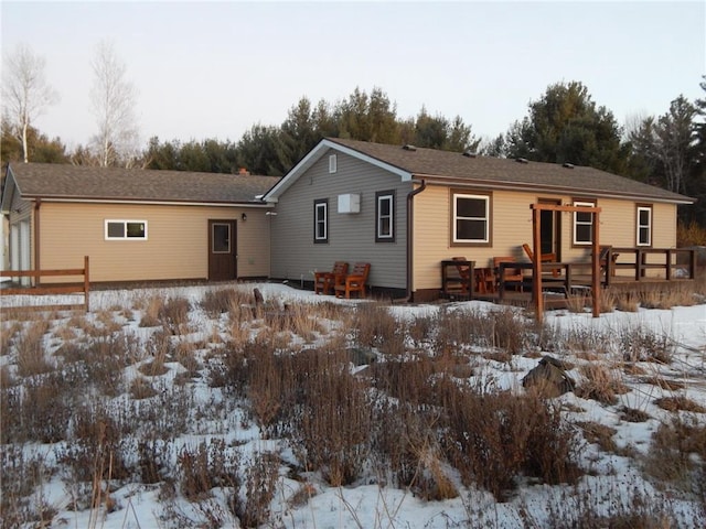 ranch-style house with a wooden deck