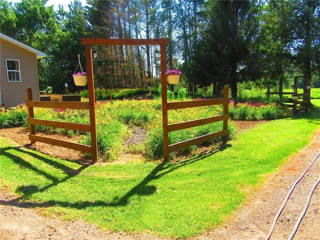 view of gate featuring a yard